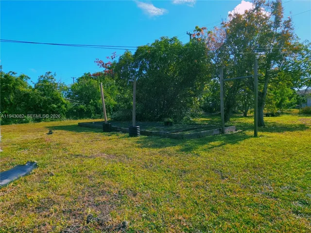 a view of outdoor space with deck and yard