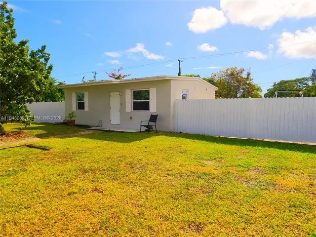 a view of a swimming pool with an outdoor space and seating area