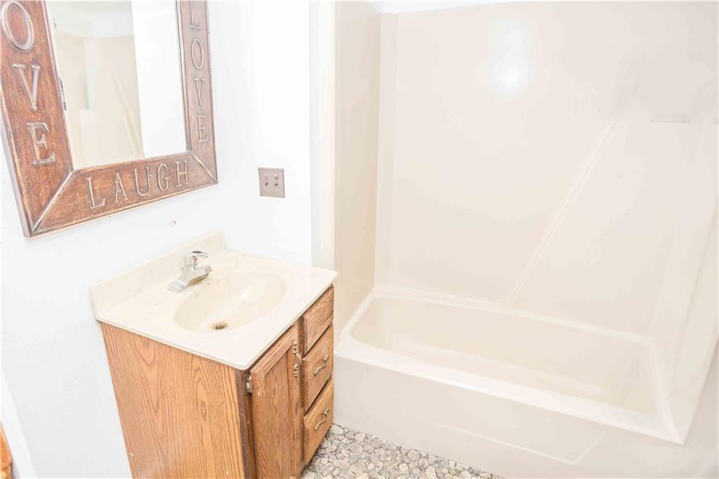 7336 Pollock Road Marion Center, PA 15759 - Photo 15 of 28 a bathroom with a sink a mirror and a bathtub