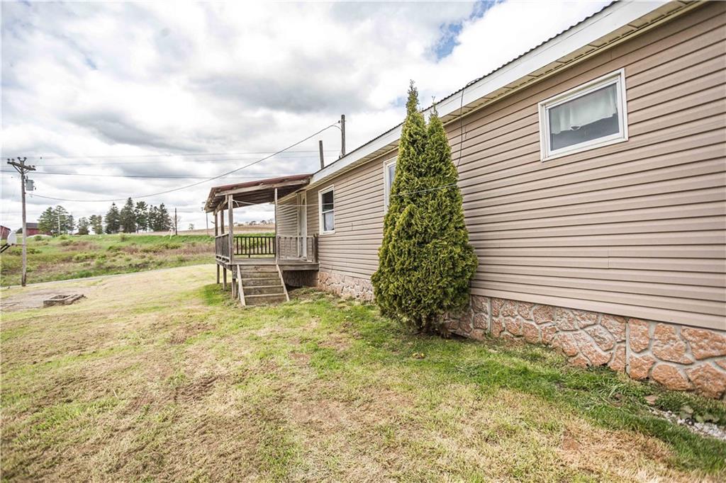 7336 Pollock Road Marion Center, PA 15759 - Photo 5 of 28 a backyard of a house with a garden and barbeque oven