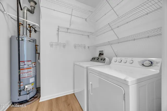 a dining room with furniture and a floor to ceiling window