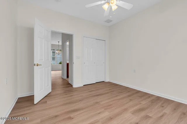 a large hall with kitchen island dining table and chairs