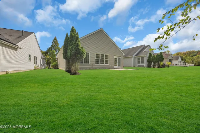 a view of a park with large trees and a park