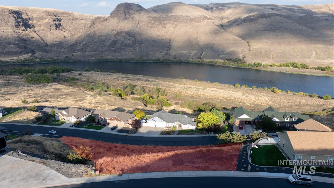 1493 River Ridge Drive Asotin, WA 99402 - Photo 2 of 14 Aerial perspective of suburban area featuring a water and mountain view