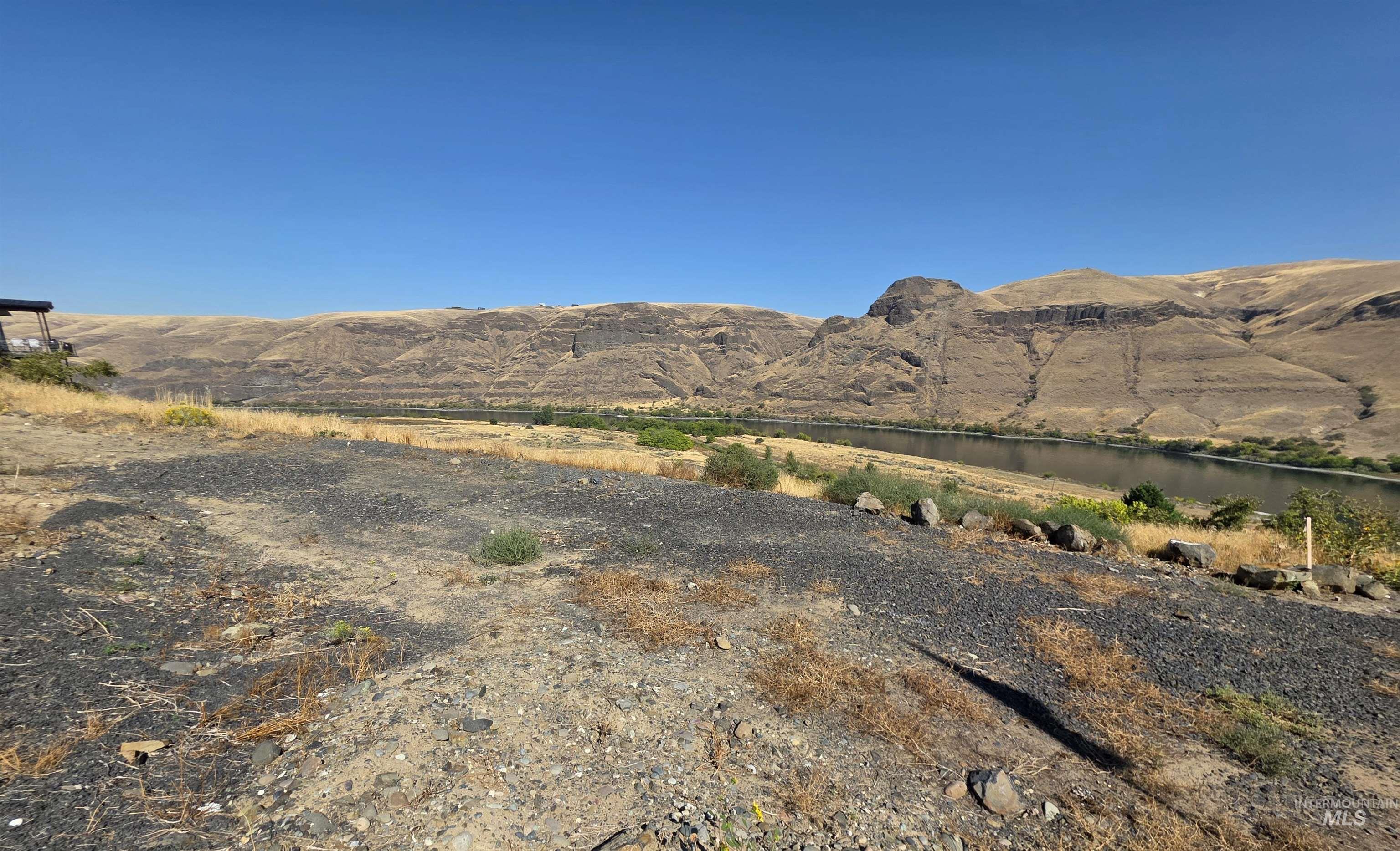 1493 River Ridge Drive Asotin, WA 99402 - Photo 10 of 14 View of mountain backdrop with a large body of water