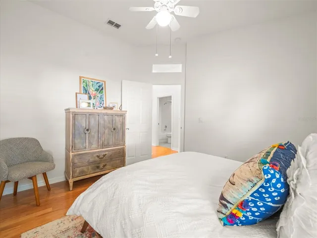 a bedroom with furniture and a window