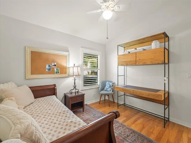 a view of a patio with a table chairs and a yard
