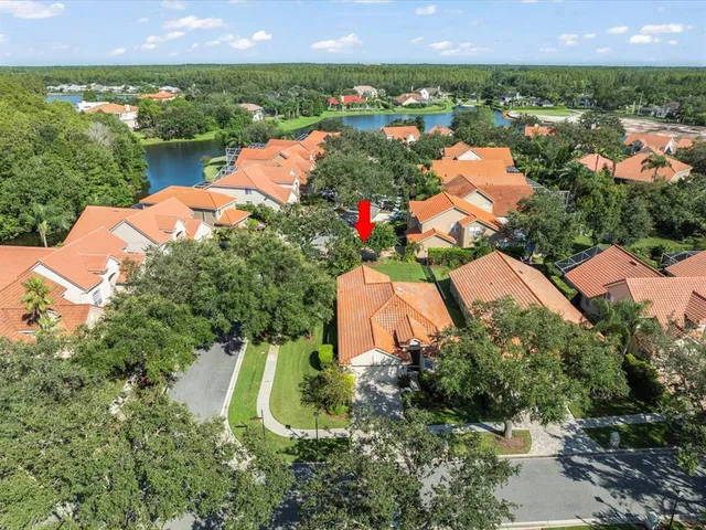 a view of a house with outdoor space and lake view