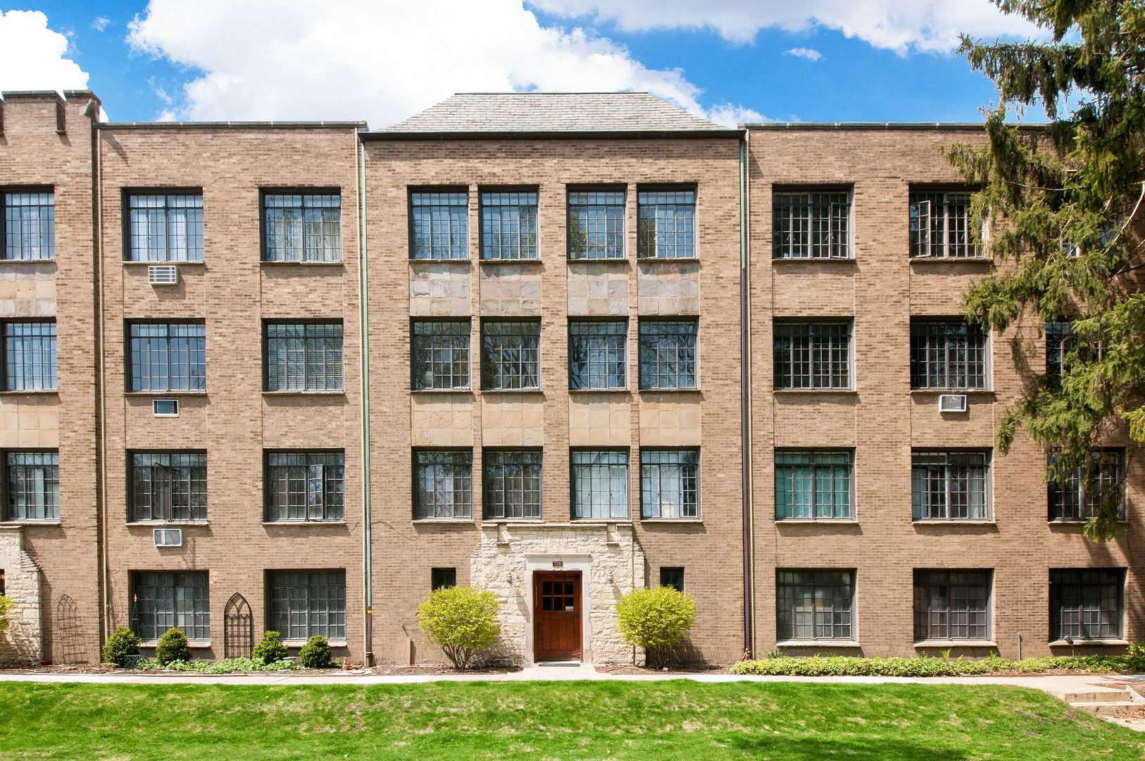 720 Noyes Street, Unit C2 Evanston, IL 60201 - Photo 1 of 14 a front view of a building with a yard