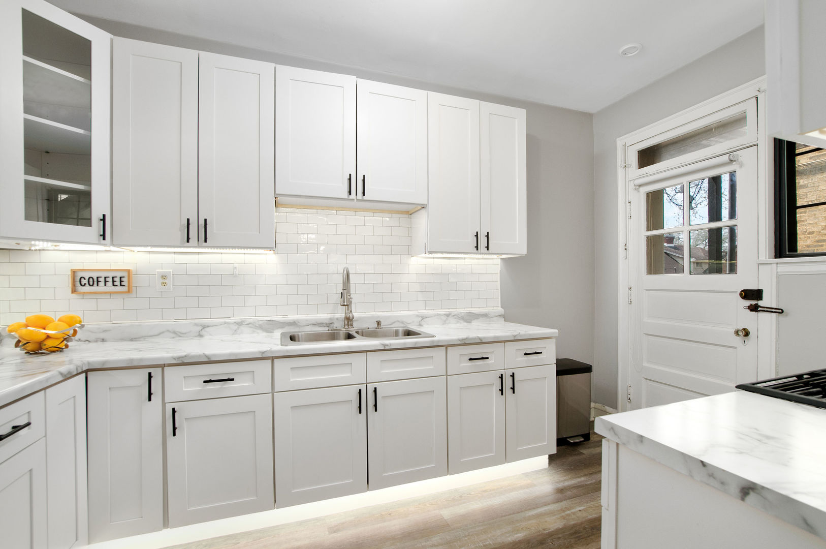720 Noyes Street, Unit C2 Evanston, IL 60201 - Photo 7 of 14 a kitchen with stainless steel appliances granite countertop a sink stove and cabinets