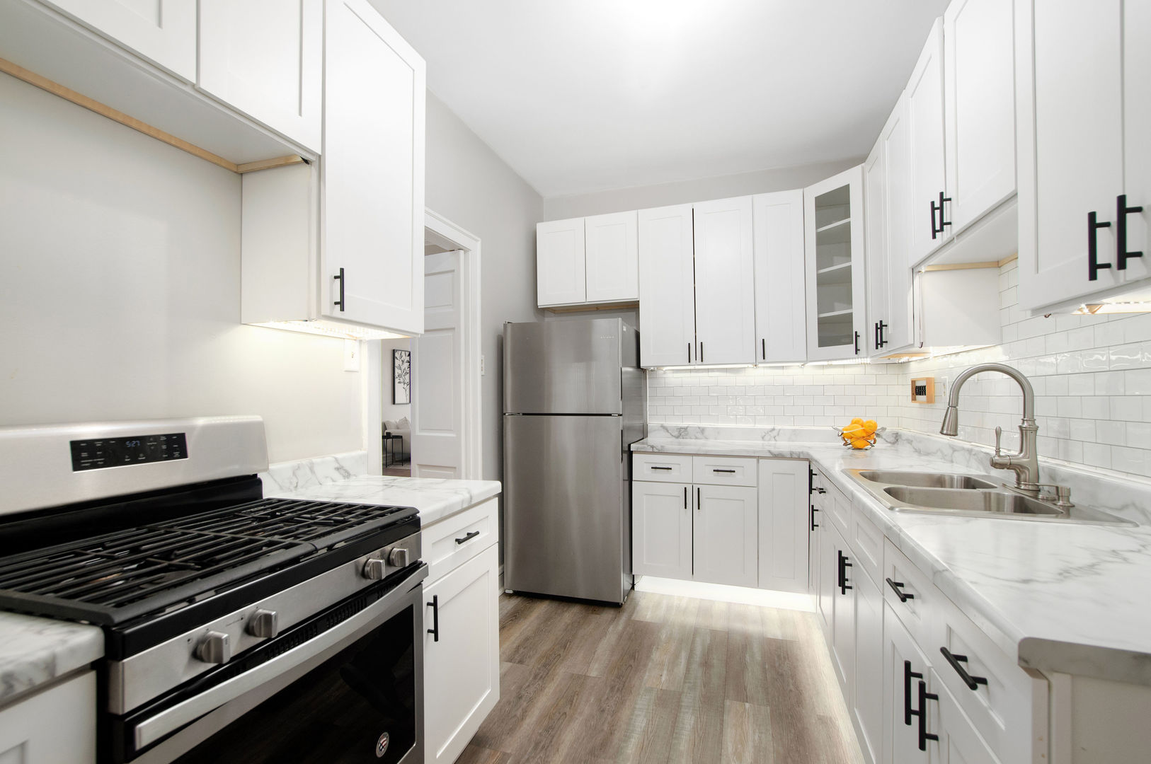 720 Noyes Street, Unit C2 Evanston, IL 60201 - Photo 8 of 14 a kitchen with a sink stove and refrigerator