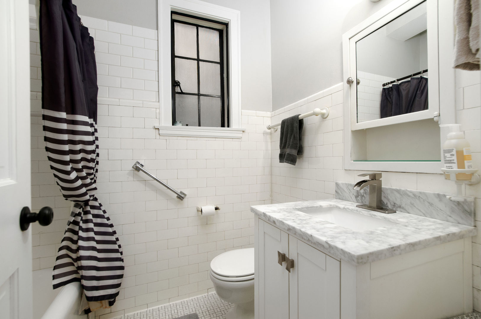 720 Noyes Street, Unit C2 Evanston, IL 60201 - Photo 10 of 14 a bathroom with a granite countertop sink and a mirror