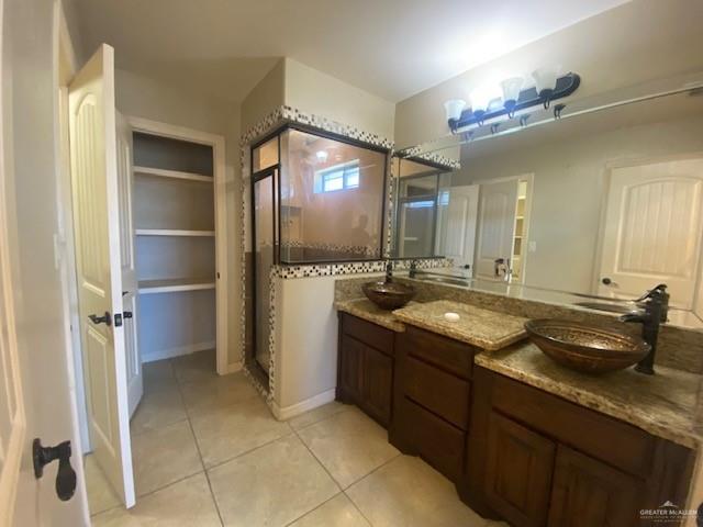 609 River Point Street Rio Grande City, TX 78582 - Photo 11 of 22 a bathroom with a granite countertop sink and a mirror