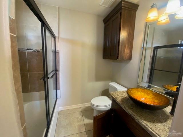 609 River Point Street Rio Grande City, TX 78582 - Photo 18 of 22 a bathroom with a granite countertop sink toilet and shower