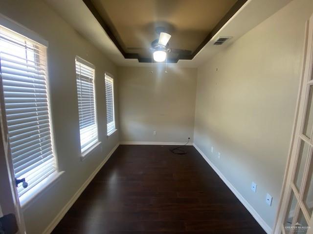 609 River Point Street Rio Grande City, TX 78582 - Photo 2 of 22 an empty room with wooden floor and windows
