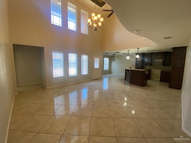 609 River Point Street Rio Grande City, TX 78582 - Photo 3 of 22 a lobby with a furniture and chandelier