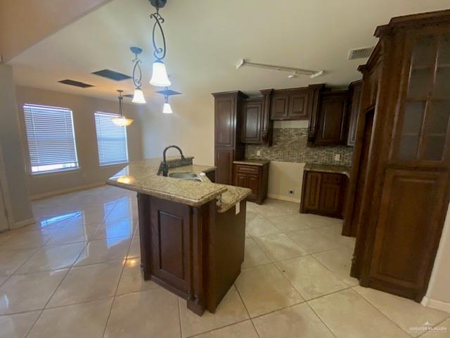 609 River Point Street Rio Grande City, TX 78582 - Photo 6 of 22 a kitchen with stainless steel appliances granite countertop a sink and a refrigerator