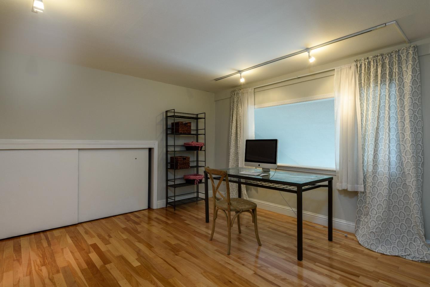 29 Pinehurst Lane Half Moon Bay, CA 94019 - Photo 12 of 17 a view of work space with wooden floor and windows