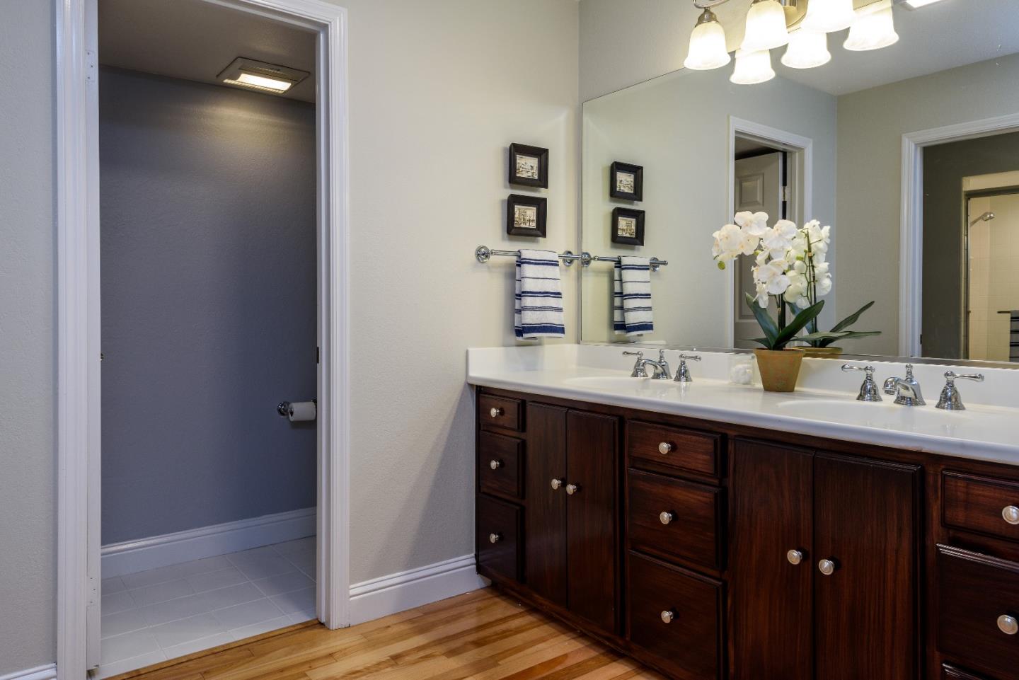 29 Pinehurst Lane Half Moon Bay, CA 94019 - Photo 8 of 17 a bathroom with a double vanity sink and a mirror