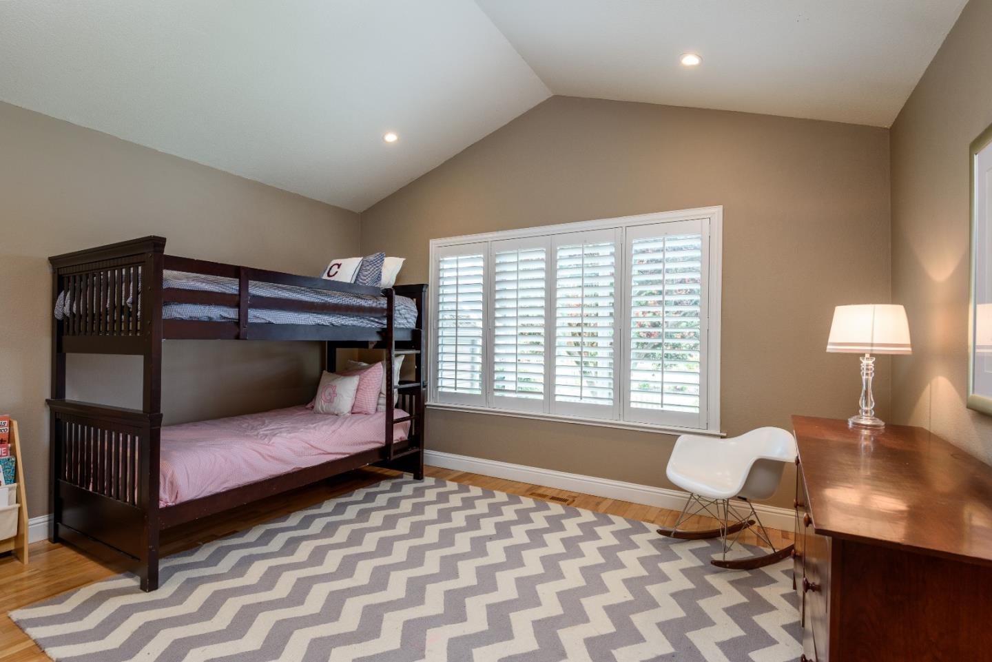 29 Pinehurst Lane Half Moon Bay, CA 94019 - Photo 10 of 17 a bedroom with a bed and a lamp