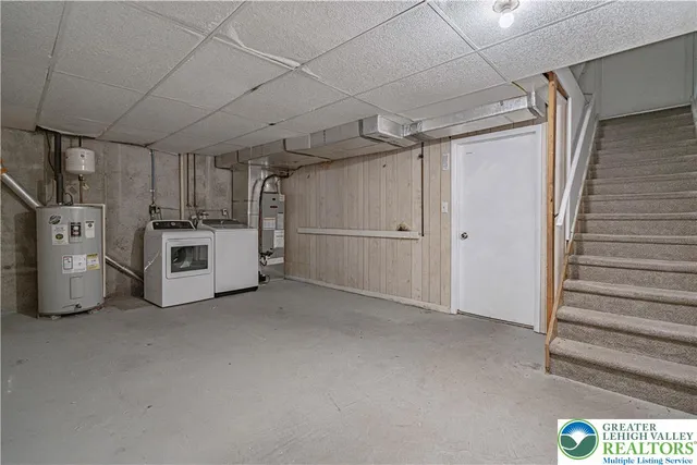 a view of a kitchen with refrigerator and more cabinets