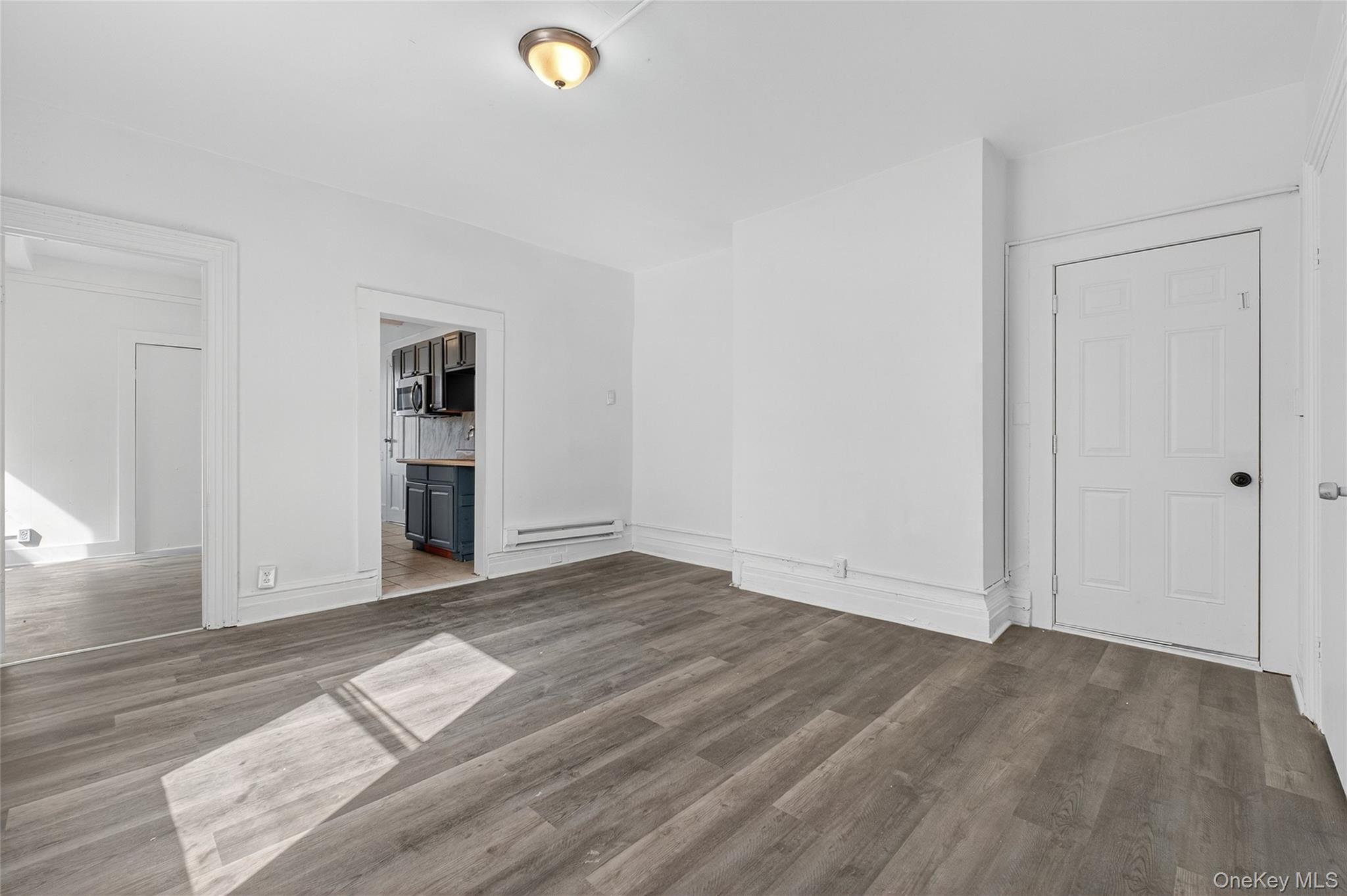 49 South Hamilton Street, Unit 2 Poughkeepsie, NY 12601 - Photo 4 of 20 an empty room with wooden floor and closet