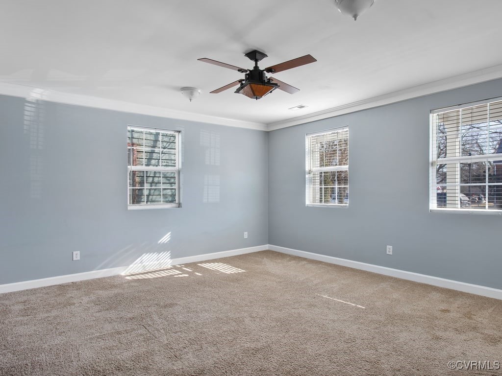 1411 Decatur Street Richmond, VA 23224 - Photo 6 of 20 Spare room featuring crown molding, ceiling fan, a