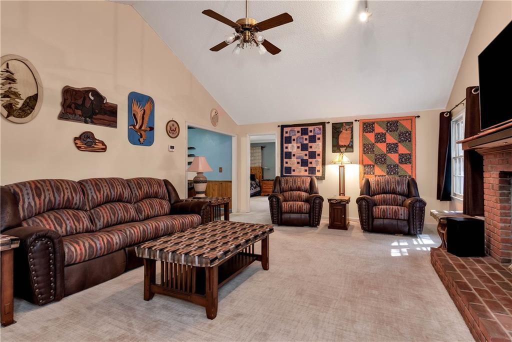 5658 Raintree Trace Oakwood, GA 30566 - Photo 7 of 55 a living room with furniture and a flat screen tv