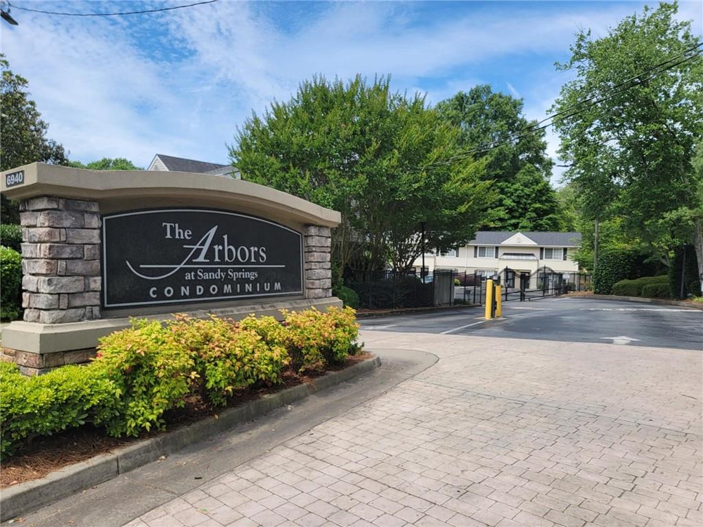 a view of a sign board with yard