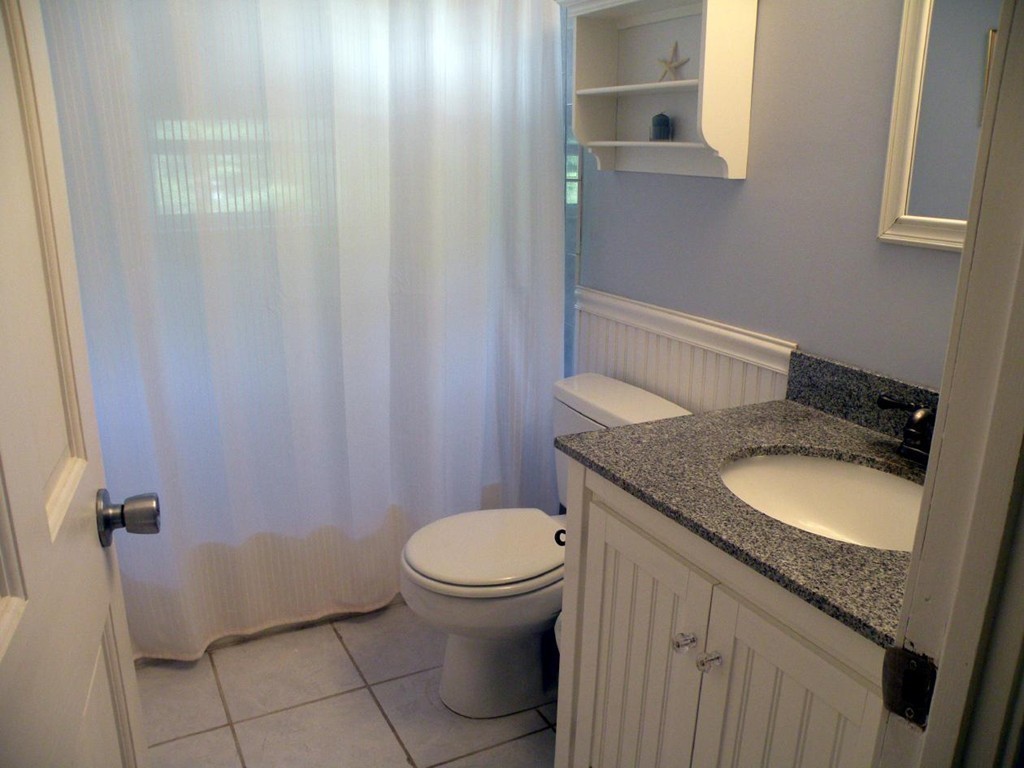 6 Kingsbury Road Canton, MA 02021 - Photo 16 of 26 a bathroom with a granite countertop toilet and a sink