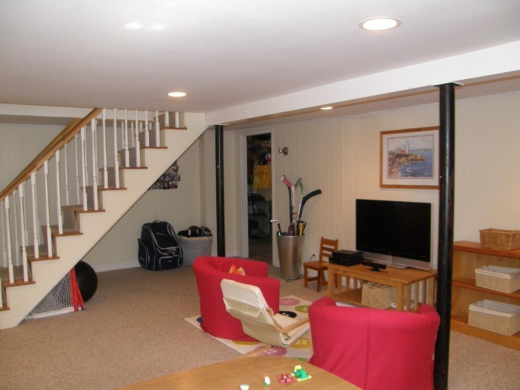 6 Kingsbury Road Canton, MA 02021 - Photo 22 of 26 a living room with furniture and a flat screen tv