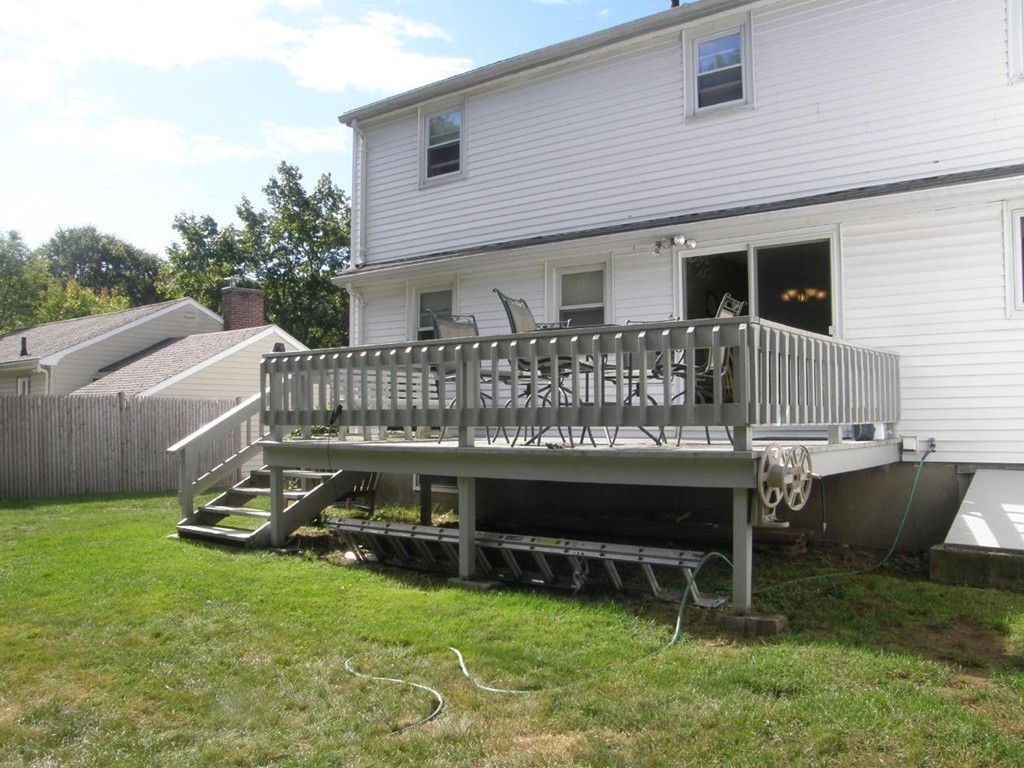 6 Kingsbury Road Canton, MA 02021 - Photo 24 of 26 a view of a house with backyard and a chair