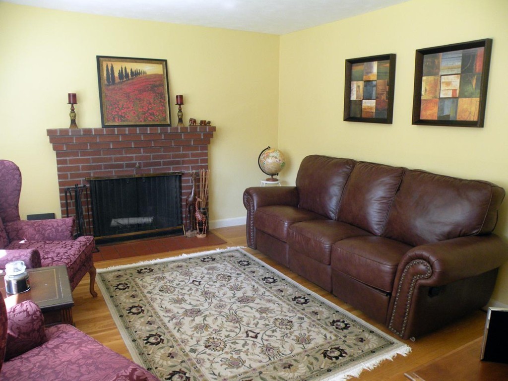 6 Kingsbury Road Canton, MA 02021 - Photo 10 of 26 a living room with furniture and a fireplace