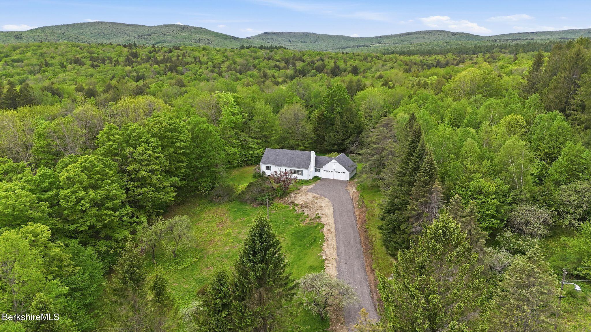 98 N Road Monroe, MA 01247 - Photo 5 of 32 a view of a city with lush green forest