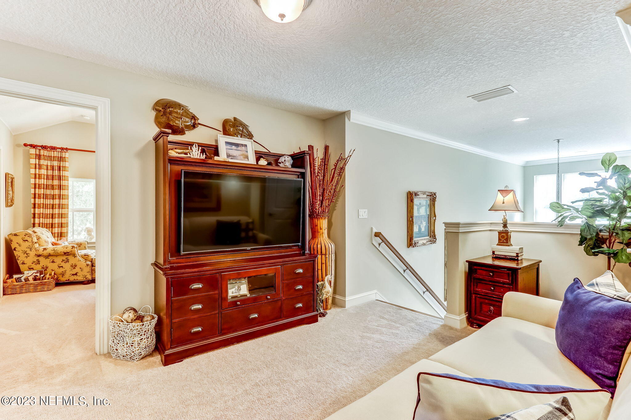 28951 Grandview Manor Yulee, FL 32097 - Photo 16 of 35 a living room with furniture and a flat screen tv