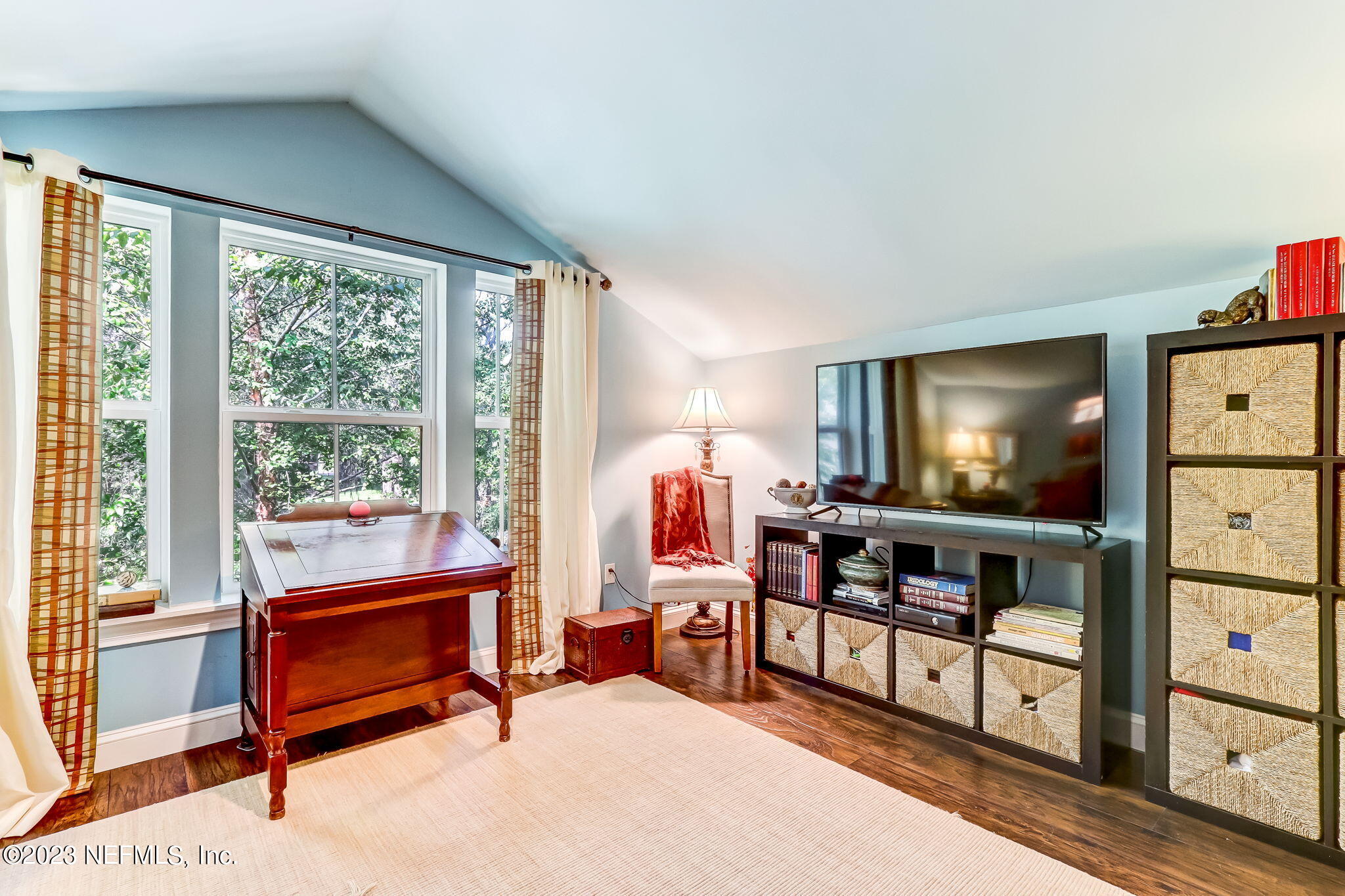 28951 Grandview Manor Yulee, FL 32097 - Photo 22 of 35 a living room with furniture a window and a flat screen tv