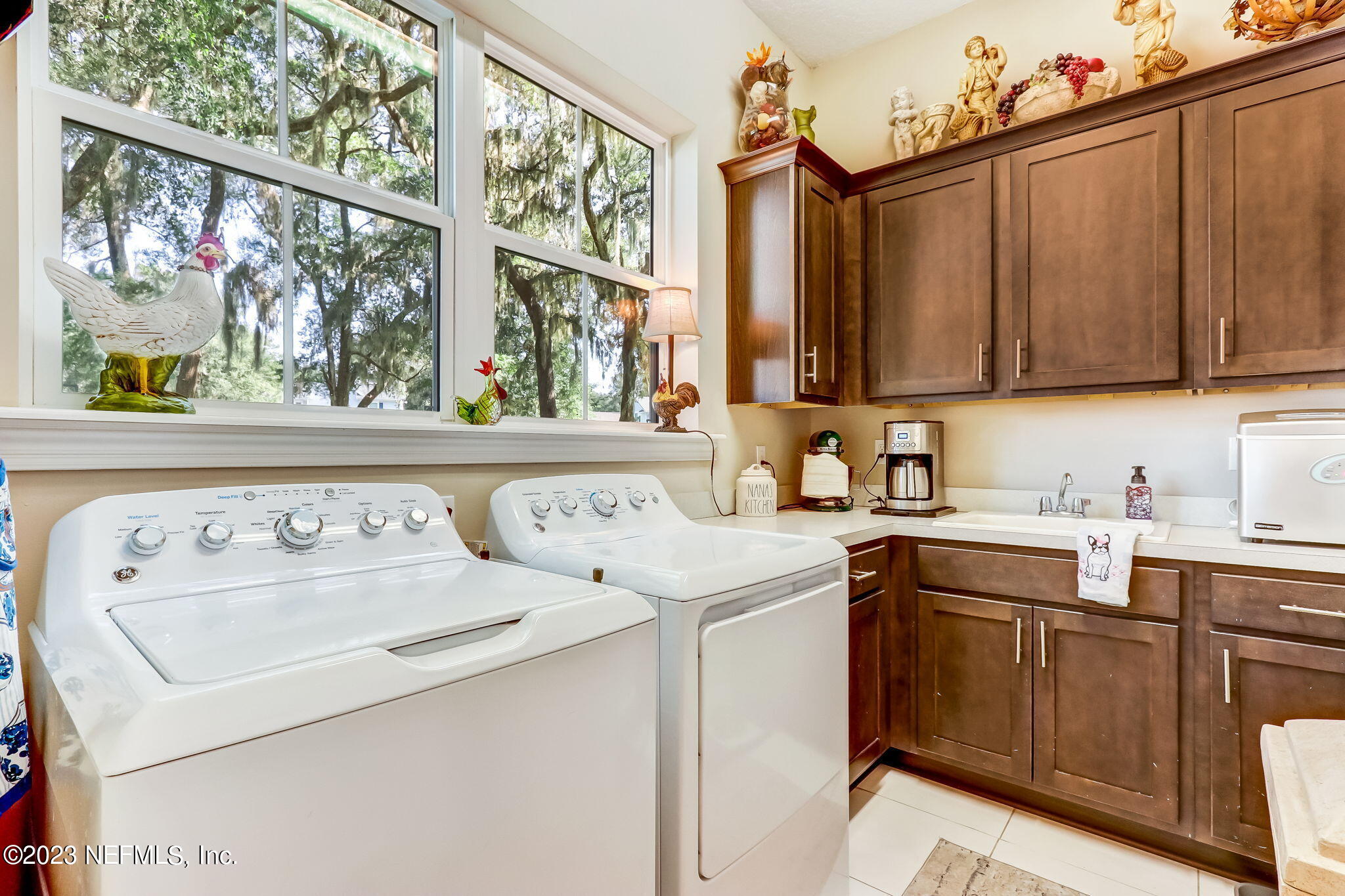 28951 Grandview Manor Yulee, FL 32097 - Photo 23 of 35 a utility room with sink dryer and washer