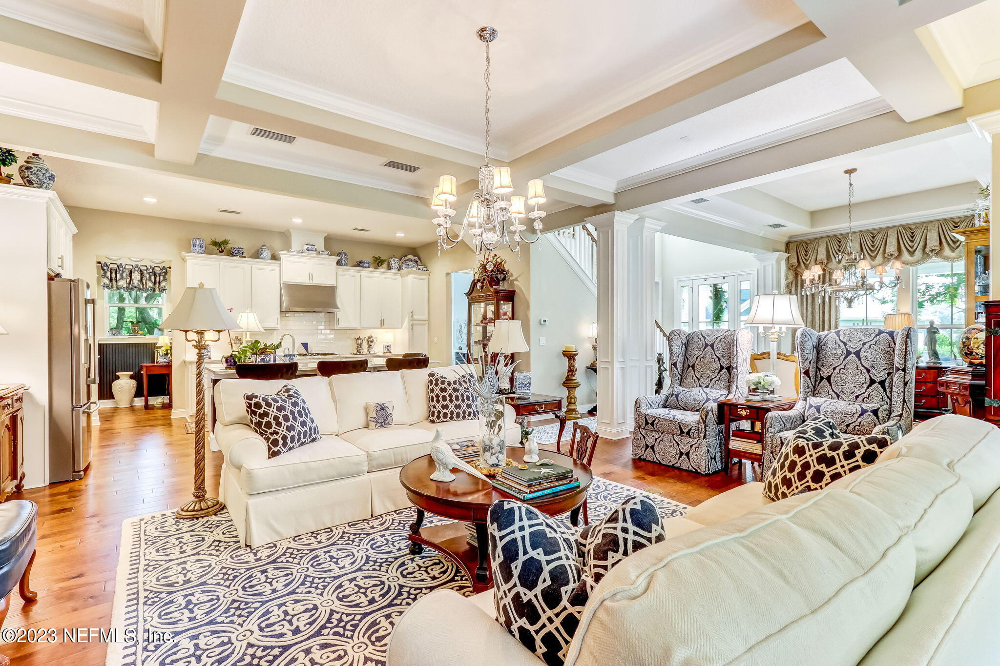 28951 Grandview Manor Yulee, FL 32097 - Photo 7 of 35 a living room with furniture and a chandelier