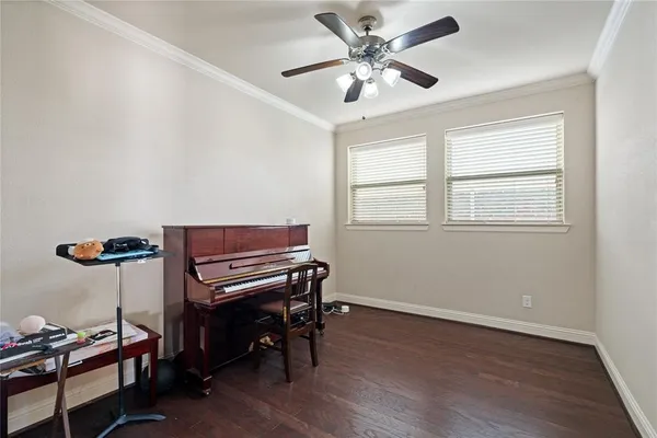 a view of a livingroom and a kitchen with wooden floor