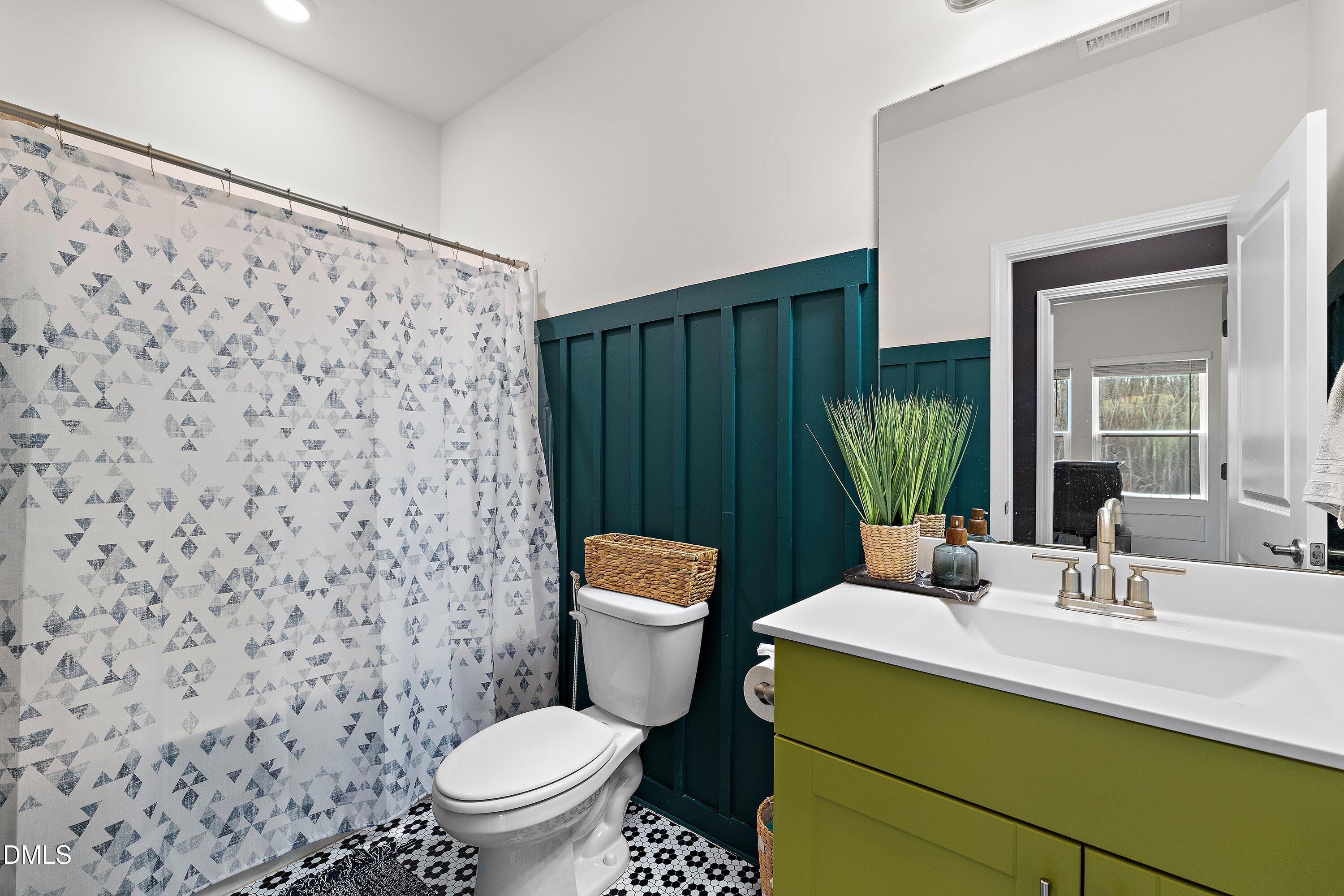 154 Anise Tree Way Clayton, NC 27527 - Photo 20 of 43 a bathroom with a sink toilet and shower