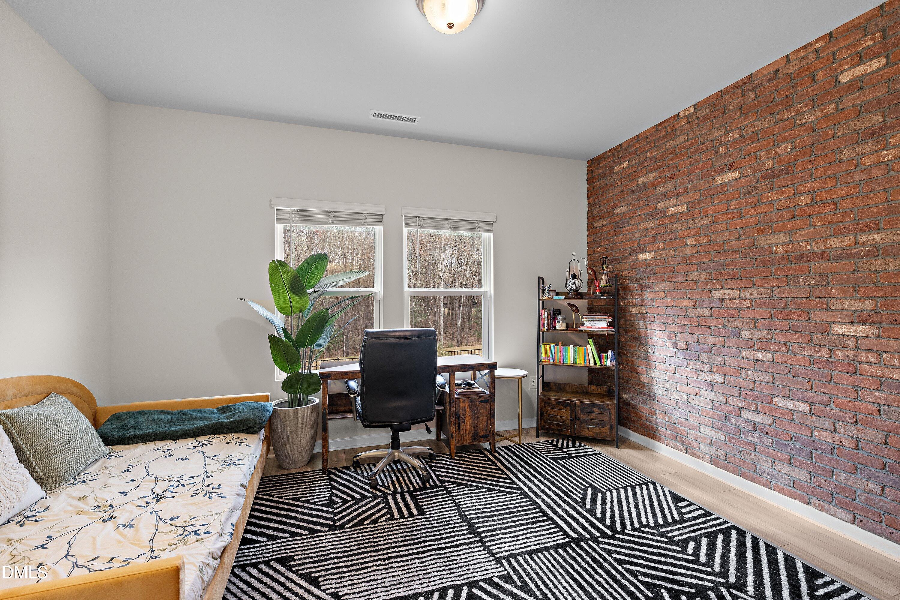 154 Anise Tree Way Clayton, NC 27527 - Photo 21 of 43 a living room with furniture and a rug