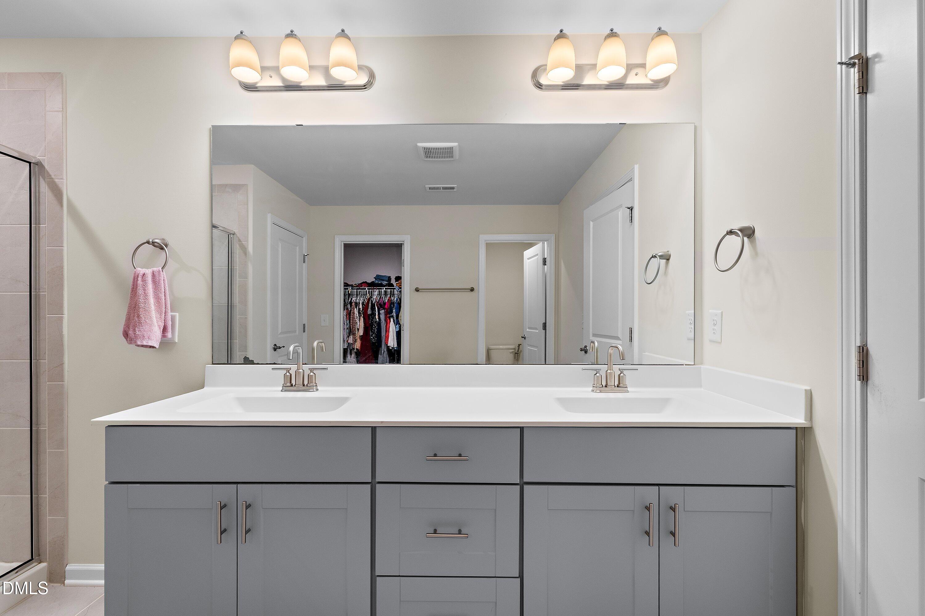 154 Anise Tree Way Clayton, NC 27527 - Photo 27 of 43 a bathroom with a sink and a mirror