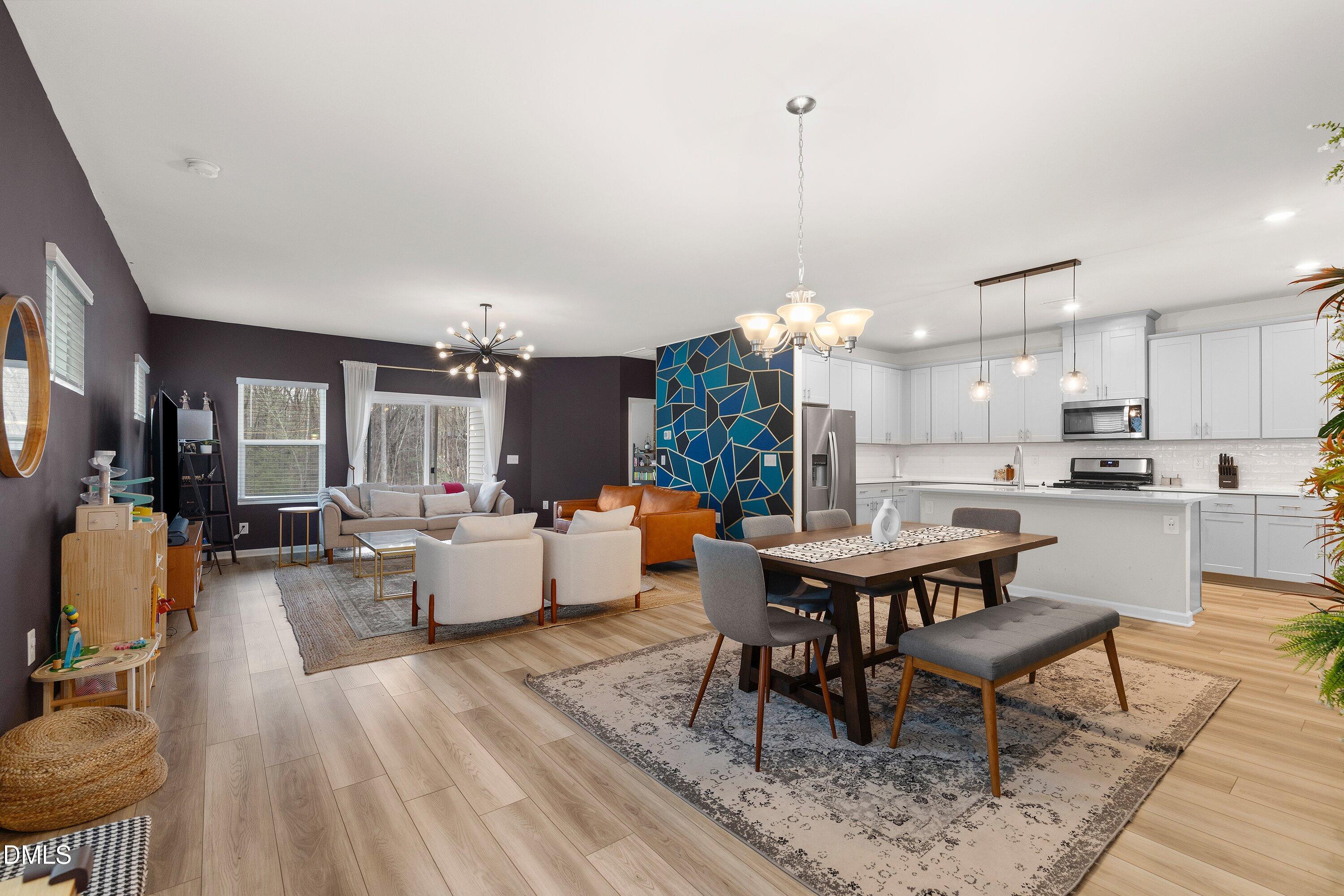 154 Anise Tree Way Clayton, NC 27527 - Photo 6 of 43 a living room with dining room and kitchen view