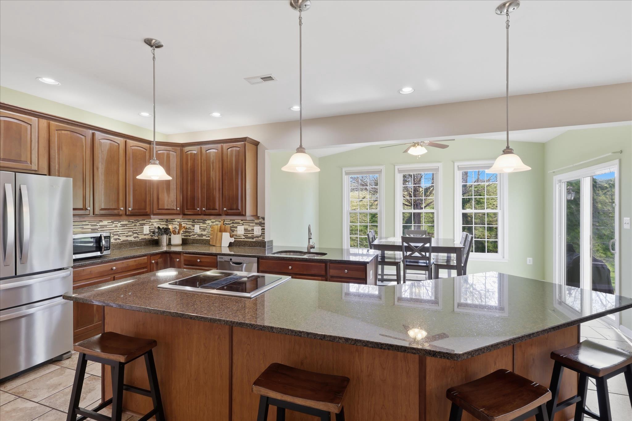 305 Tiger Way Boonsboro, MD 21713 - Photo 24 of 79 a kitchen with counter space dining table and chairs