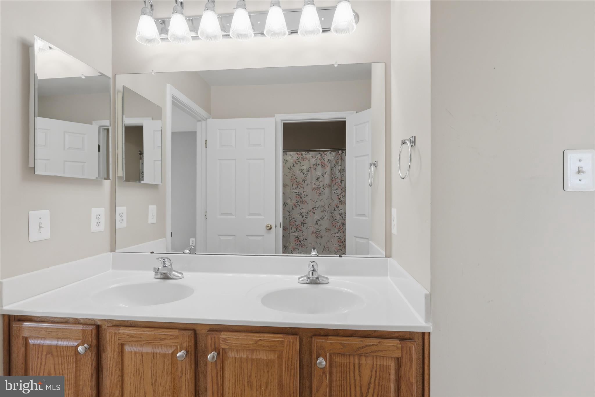 305 Tiger Way Boonsboro, MD 21713 - Photo 43 of 79 a bathroom with a sink vanity granite and a mirror