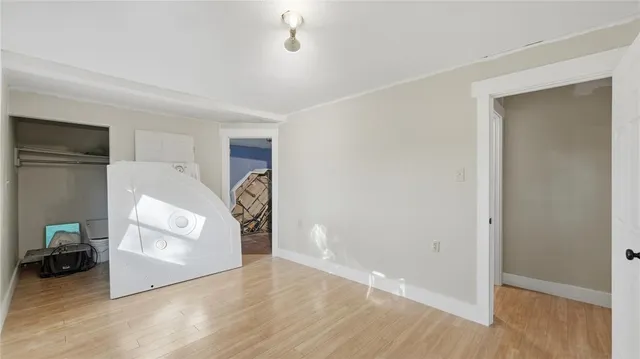 a bathroom with a toilet and a shower curtain