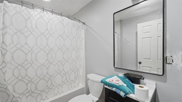 a view of livingroom with washer and dryer