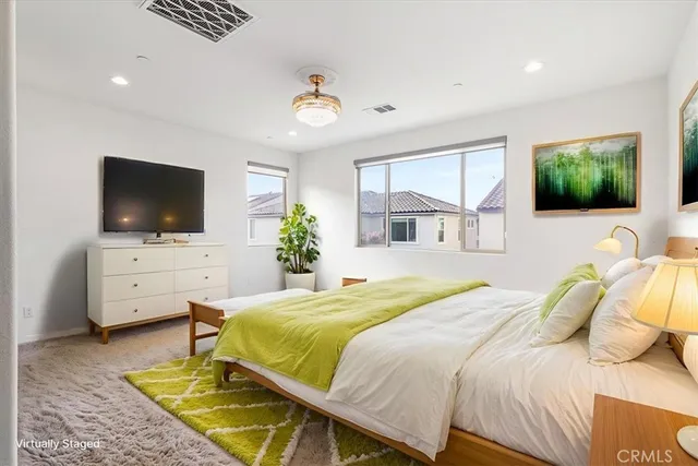 a view of a patio with couches table and chairs and potted plants