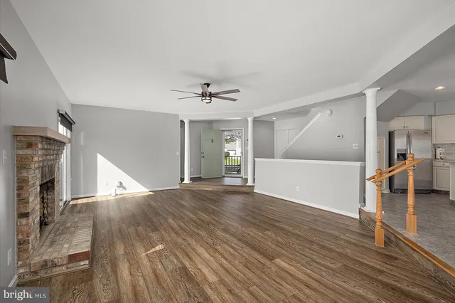 a kitchen with granite countertop a sink stove and cabinets