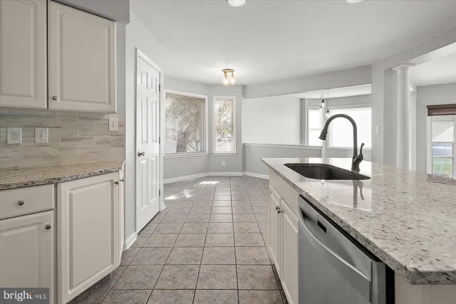 a view of an empty room and closet area